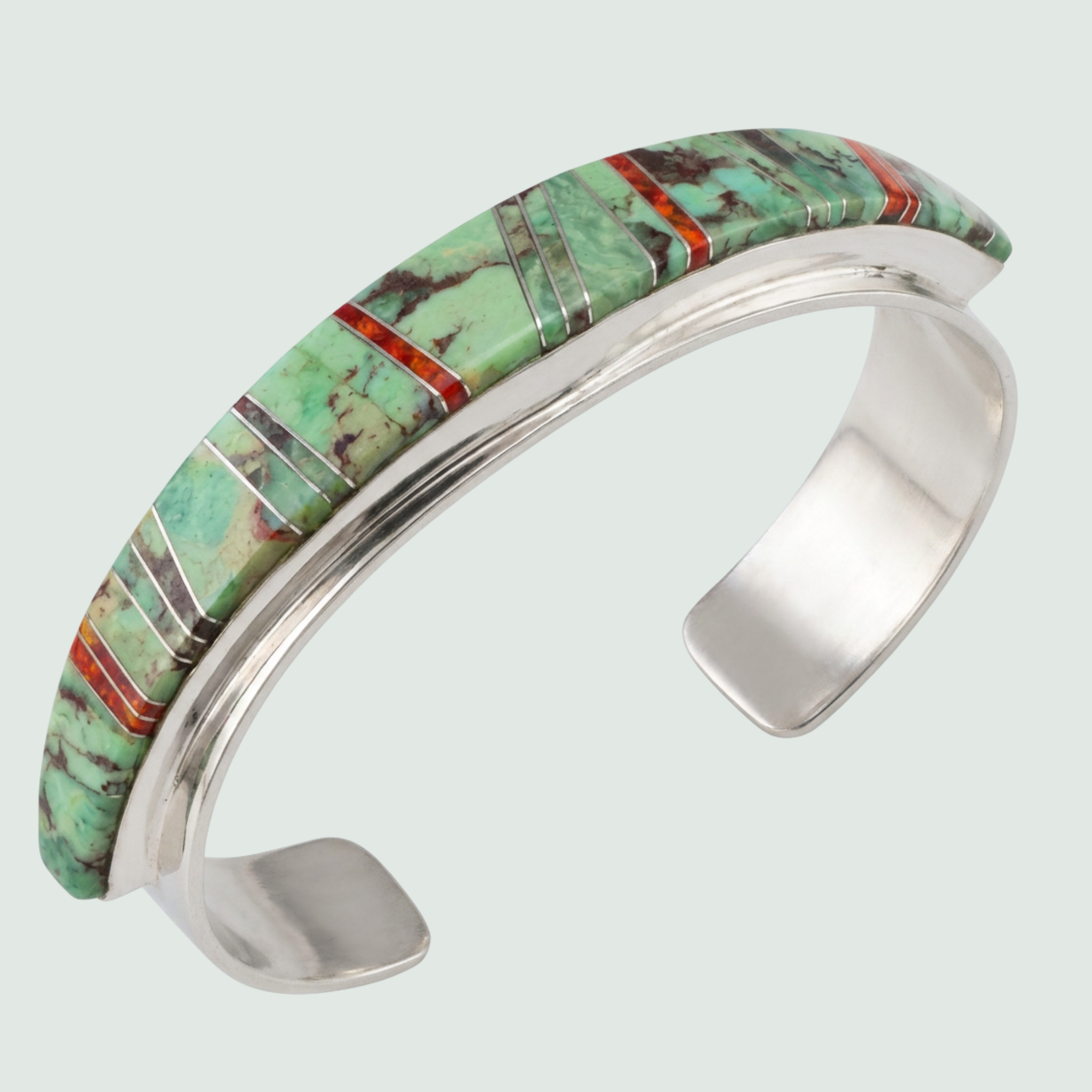 Sonoran Mountain Turquoise and Red Opal Channel Inlay Cuff in Sterling Silver, shown on a sage mist background