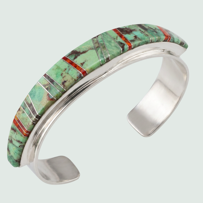 Sonoran Mountain Turquoise and Red Opal Channel Inlay Cuff in Sterling Silver, shown on a sage mist background