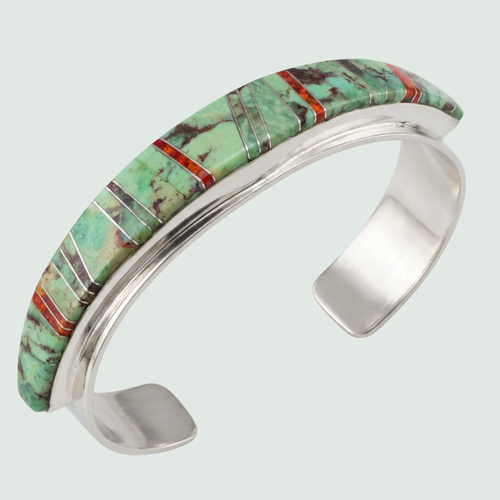 Sonoran Mountain Turquoise and Red Opal Channel Inlay Cuff in Sterling Silver, shown on a sage mist background