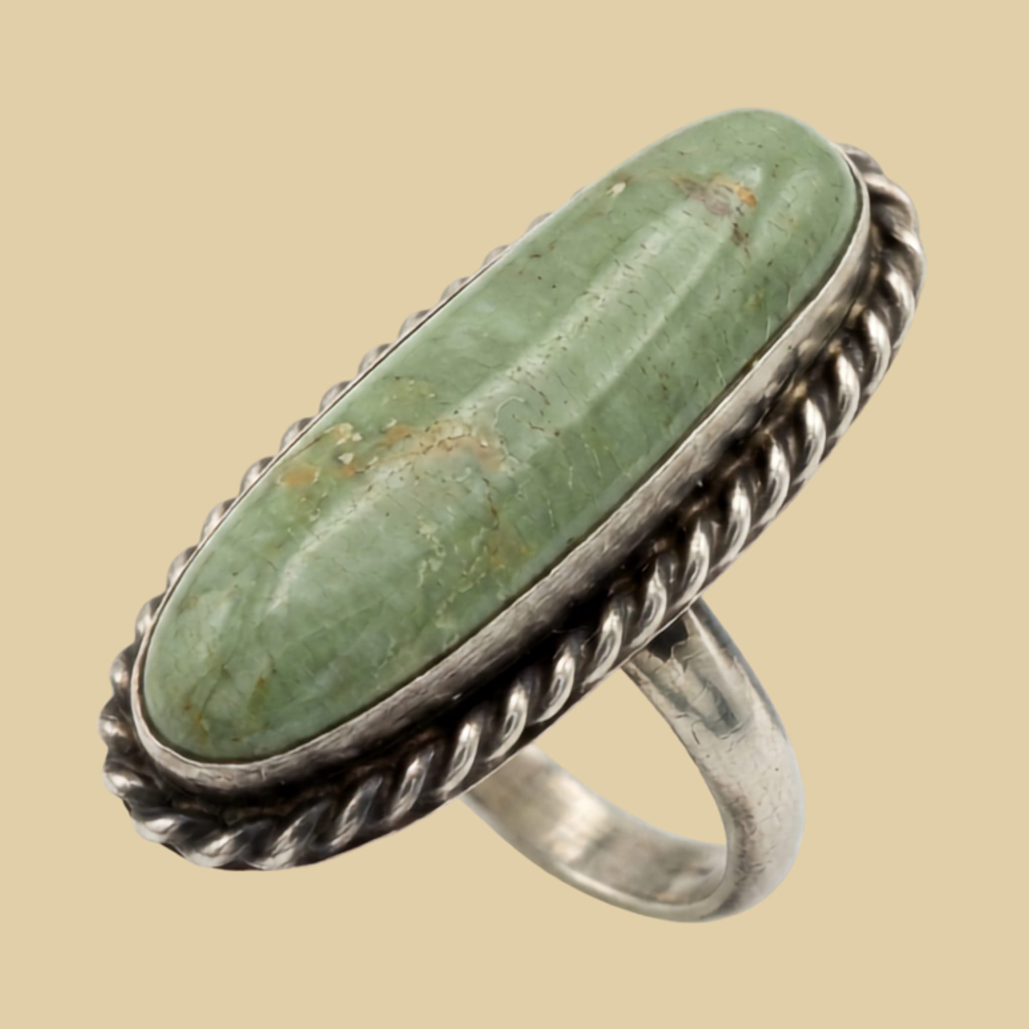 Sonoran Mountain Turquoise Long Oval Ring in Sterling Silver, Size 8, shown on a desert plaster background