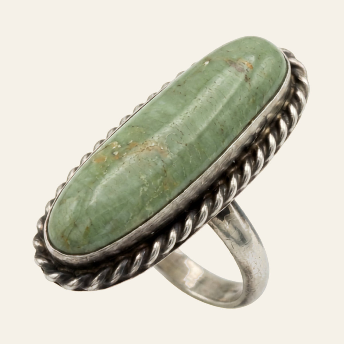 Sonoran Mountain Turquoise Ring for Men, Long Oval in Sterling Silver, Size 8, shown on a cream background