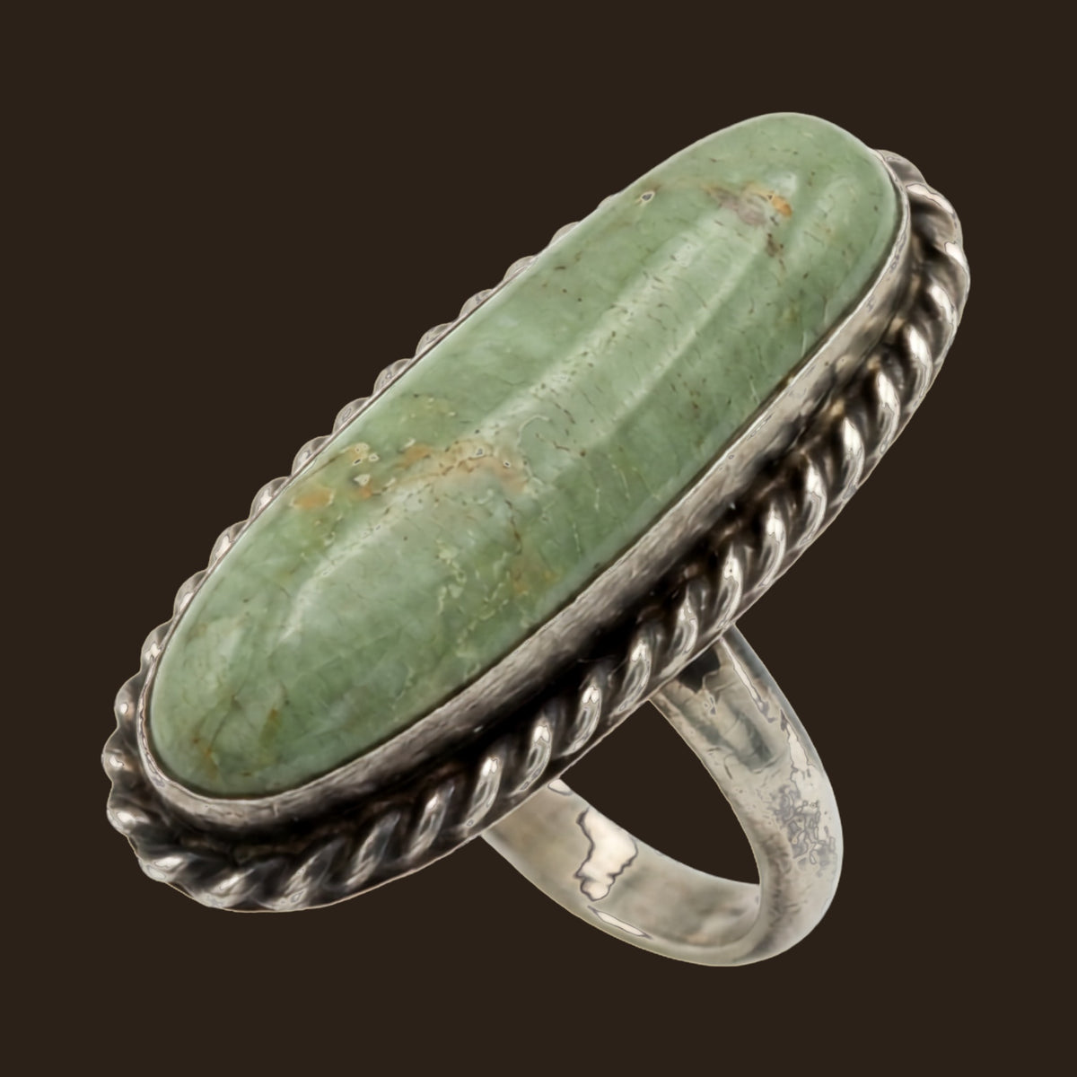 Sonoran Mountain Turquoise Ring for Men, Long Oval in Sterling Silver, Size 8, shown on an espresso background