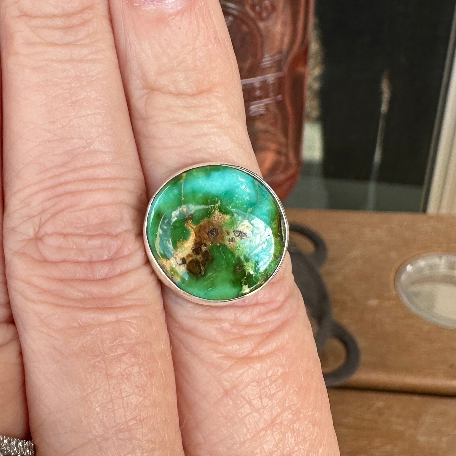 Sonoran Mountain turquoise ring in sterling silver worn on a finger, size 6 3/4