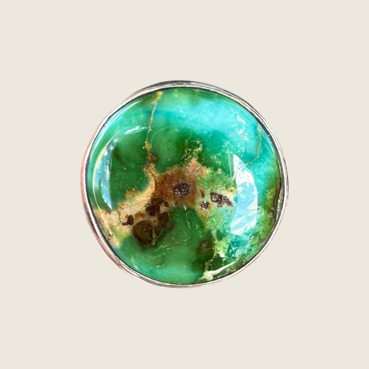 Sonoran Mountain turquoise ring in sterling silver, close-up of the saturated blue-green round cabochon