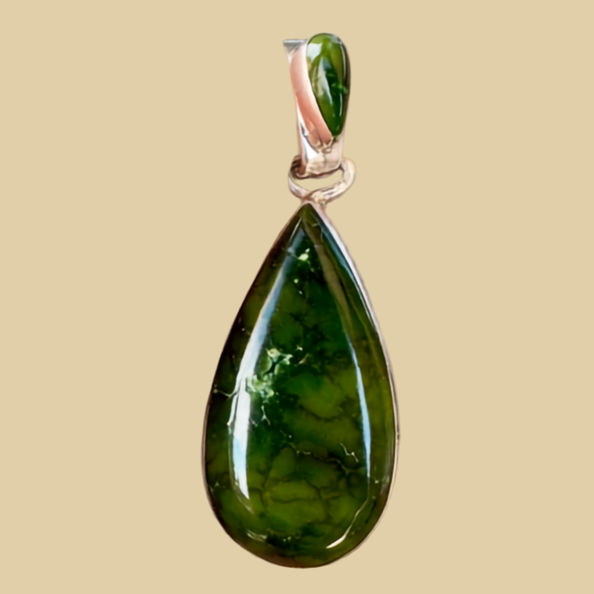 Sonoran Mountain Turquoise Teardrop Pendant in Sterling Silver, by Martinez, shown on a desert plaster background