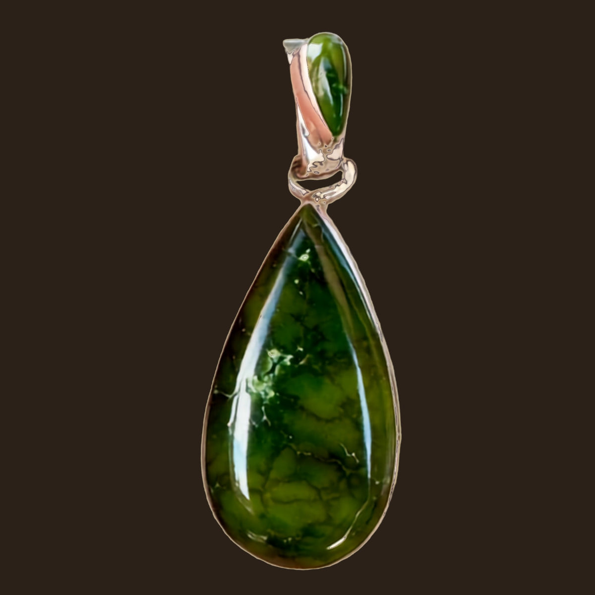Sonoran Mountain Turquoise Teardrop Pendant in Sterling Silver, by Martinez, shown on an espresso background