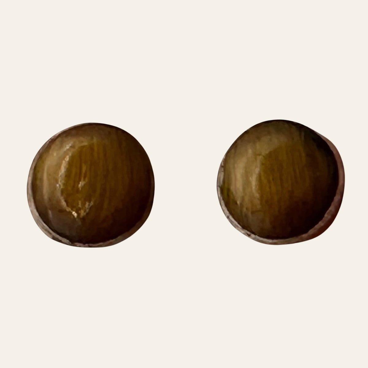 Tiger Eye Round Stud Earrings in Sterling Silver, shown on a cream background
