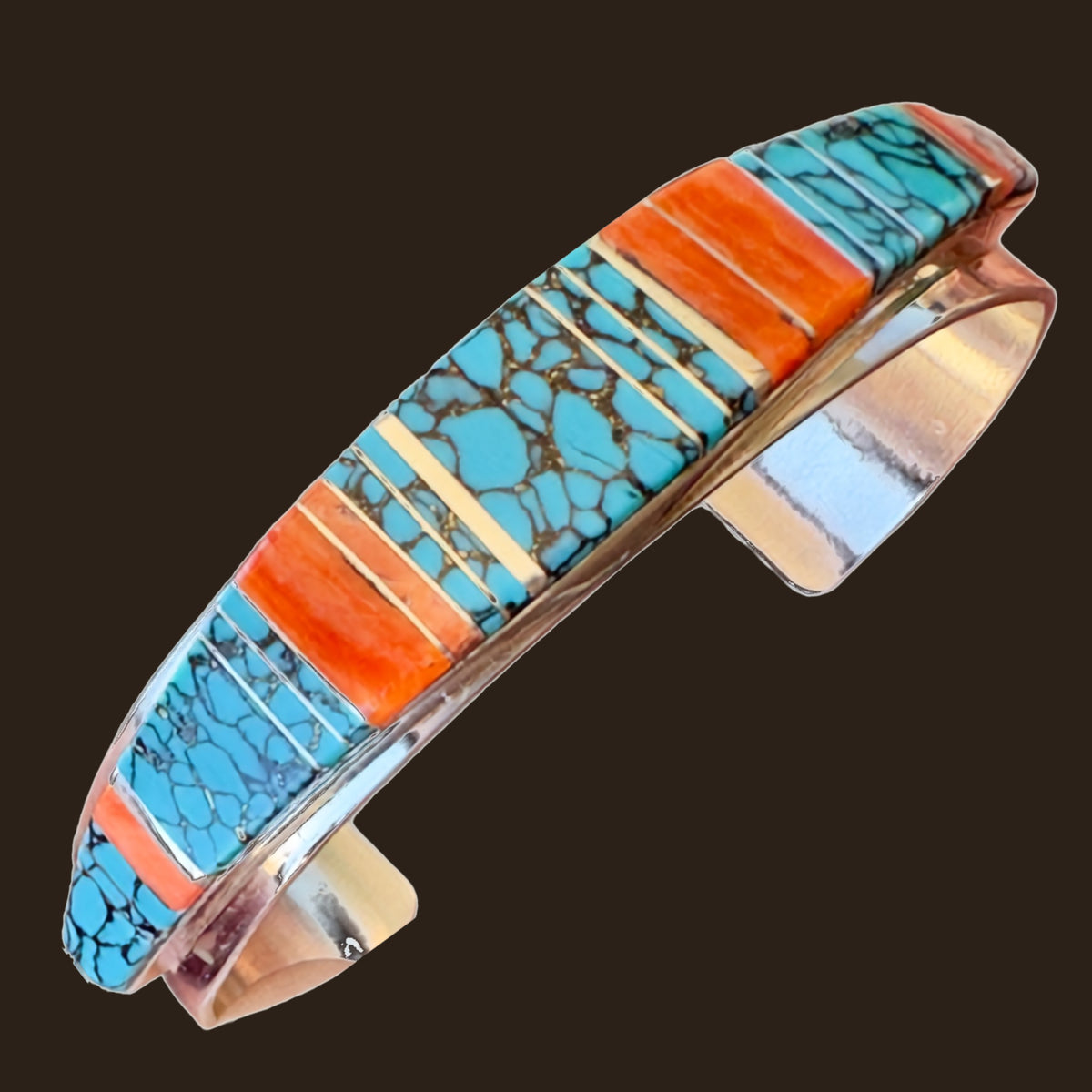 Turquoise and Spiny Oyster Channel Inlay Cuff Bracelet in Sterling Silver, shown on an espresso background