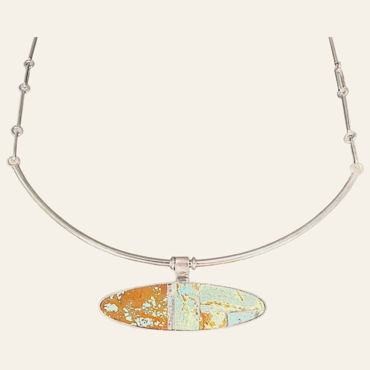 Turquoise Inlay Collar Necklace in Navajo Sterling Silver, by Harold Smith, shown on a cream background
