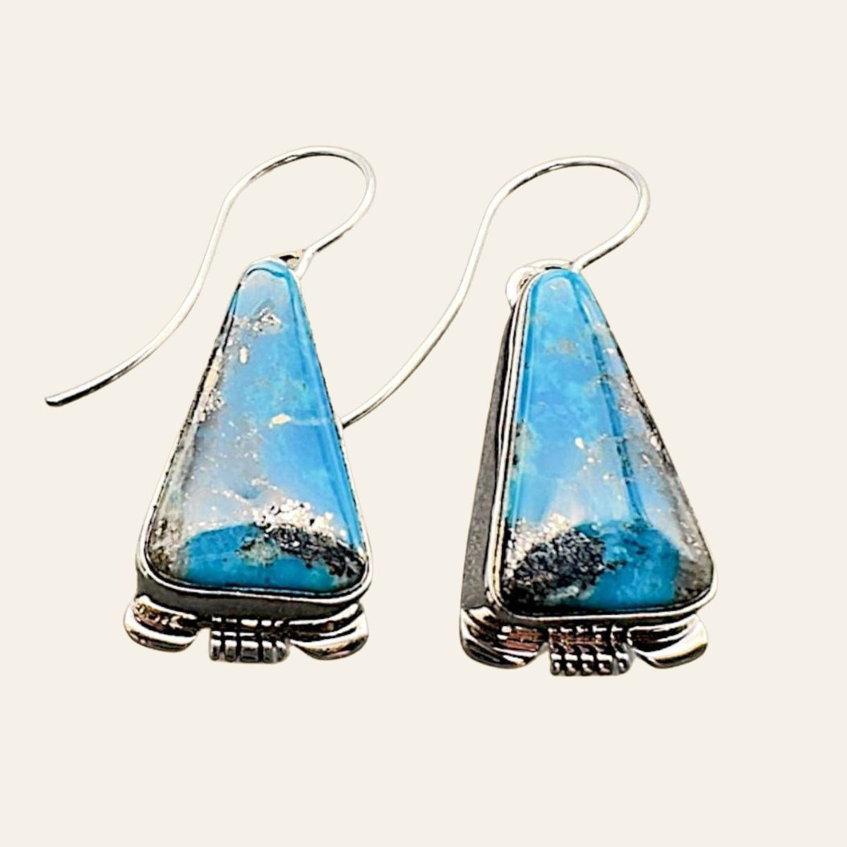 Turquoise Inlay Drop Earrings in Navajo Sterling Silver, by Larry Moses Yazzie, shown on a cream background
