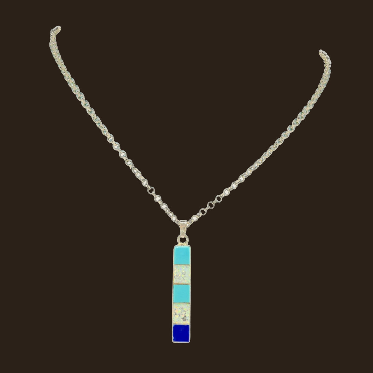 Turquoise, Opal and Lapis Necklace in Sterling Silver, by Rick Tolino, shown on an espresso background