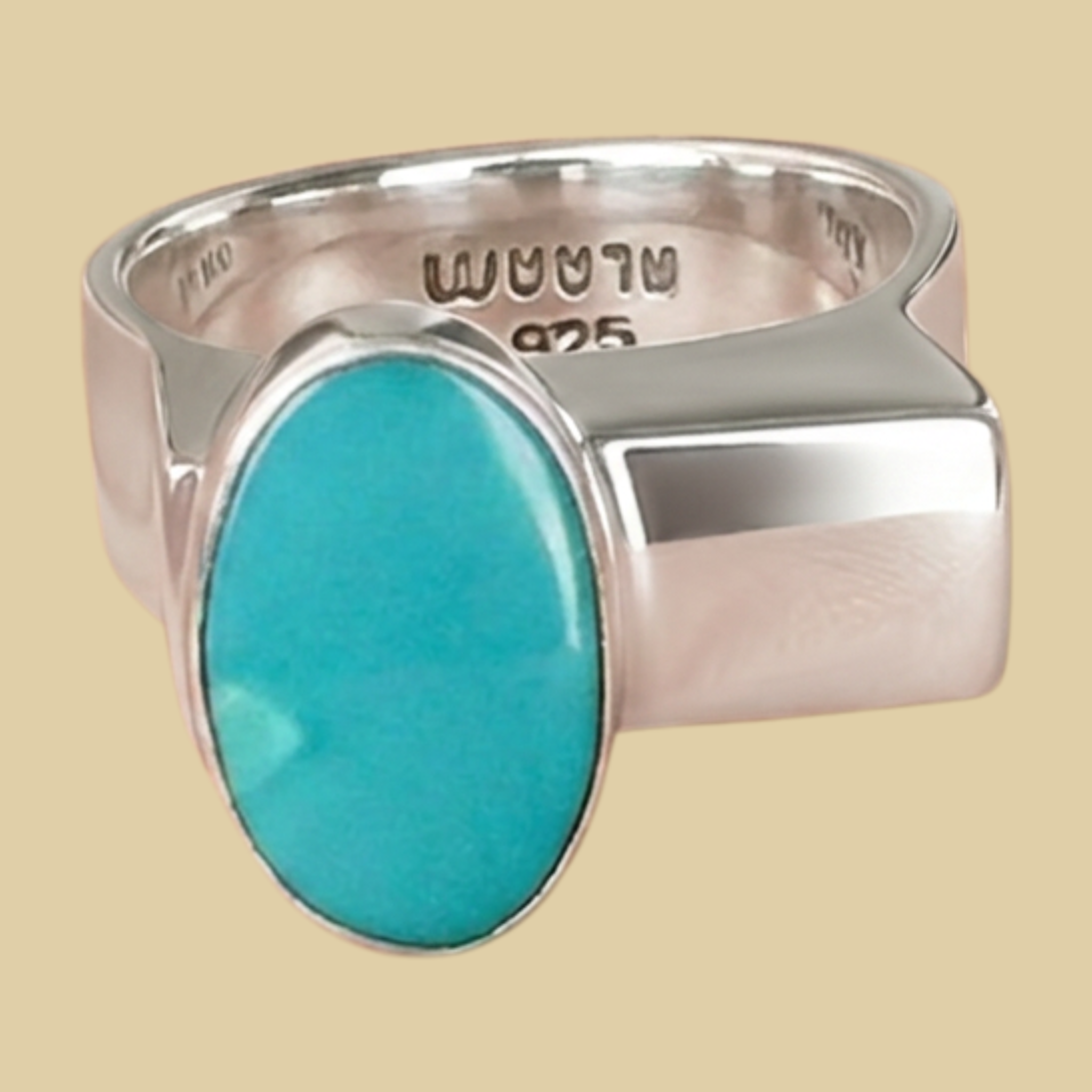 Turquoise Oval Ring in Sterling Silver, by BALAAM, Sizes 7.5 to 9, shown on a desert plaster background