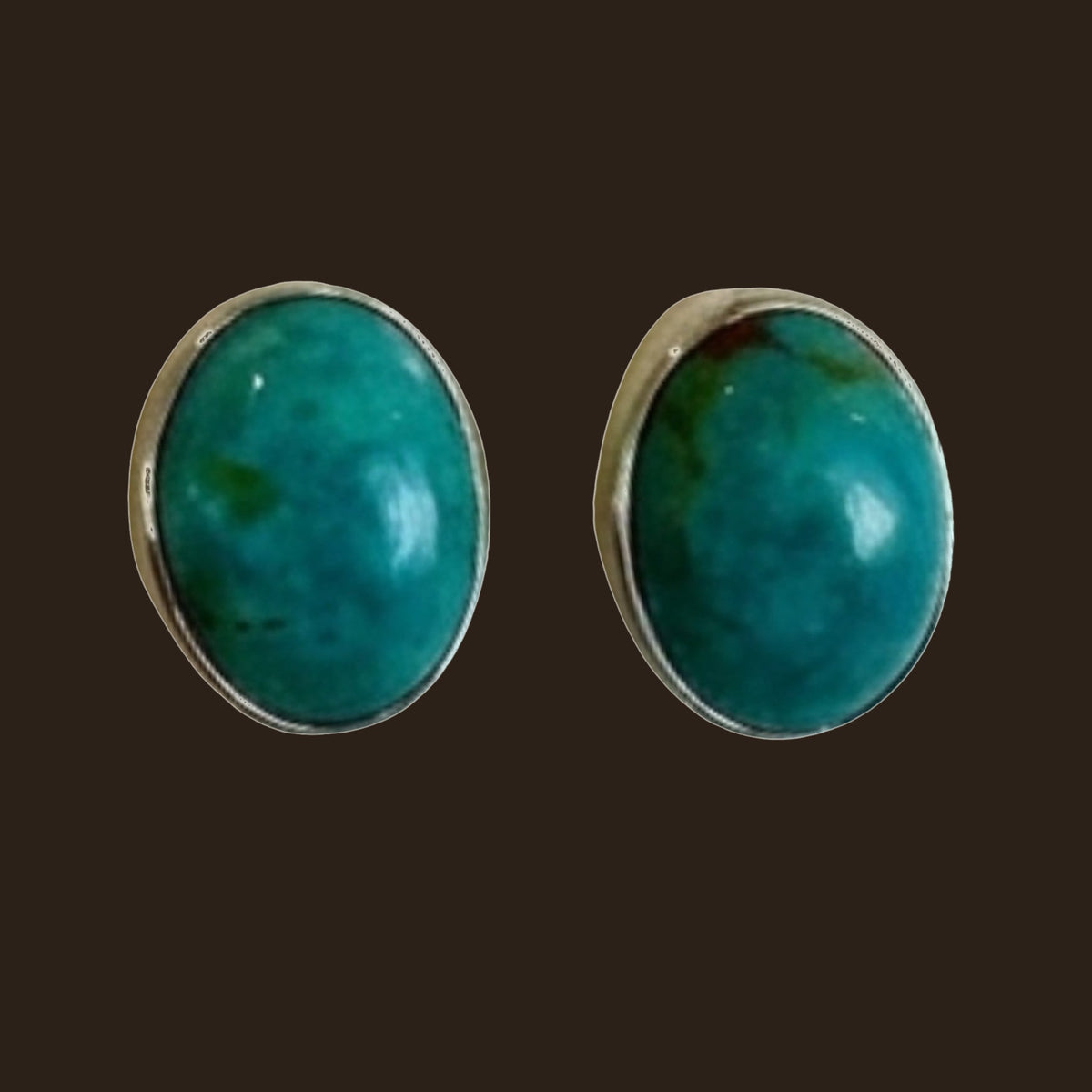 Turquoise Oval Stud Earrings in Sterling Silver, One of a Kind, shown on an espresso background