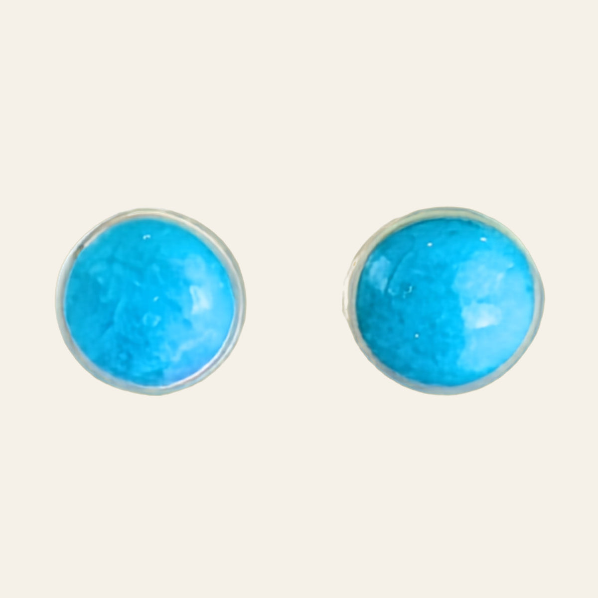 Turquoise Stud Earrings in Sterling Silver, 3mm to 5mm, shown on a cream background