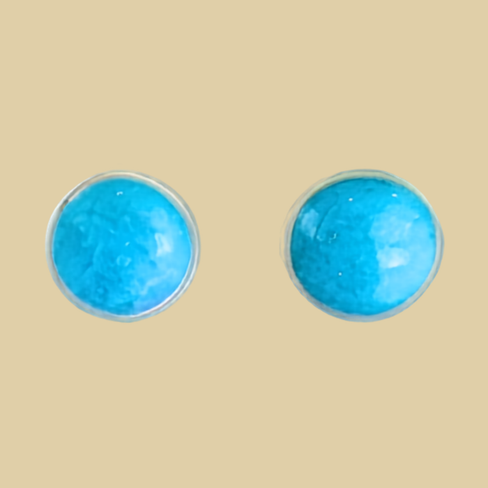 Turquoise Stud Earrings in Sterling Silver, 3mm to 5mm, shown on a desert plaster background