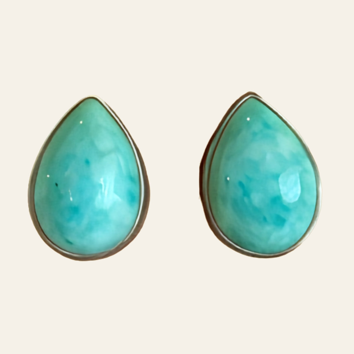 Turquoise Teardrop Stud Earrings in Sterling Silver, One of a Kind, shown on a cream background