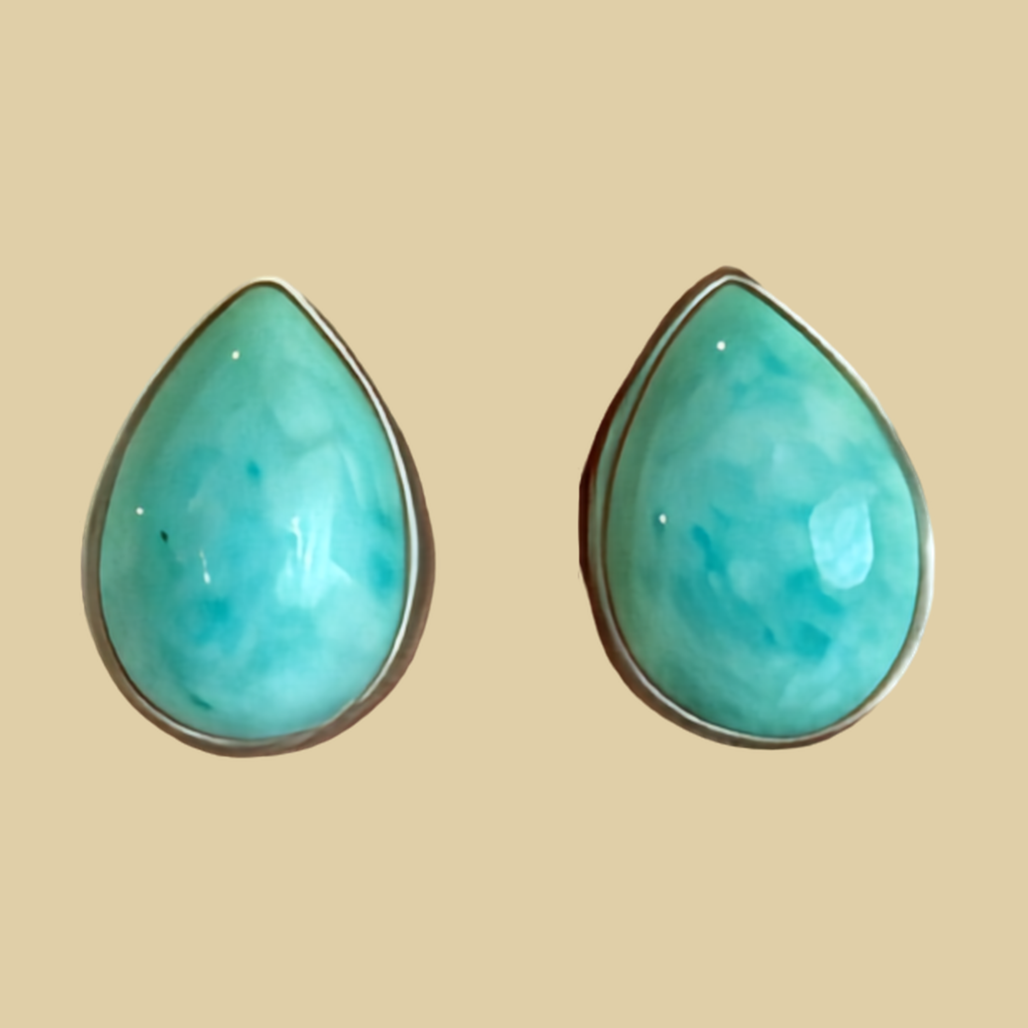 Turquoise Teardrop Stud Earrings in Sterling Silver, One of a Kind, shown on a desert plaster background
