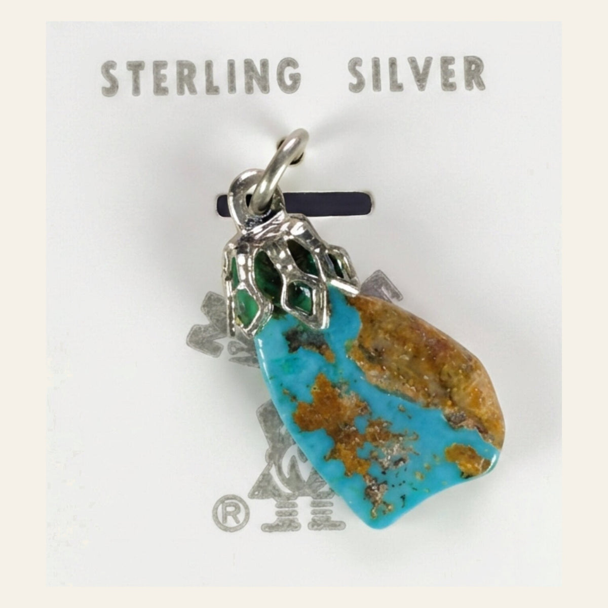Vintage Maisel's Spiderweb Turquoise Nugget Pendant in Sterling Silver, New Old Stock, shown on a cream background