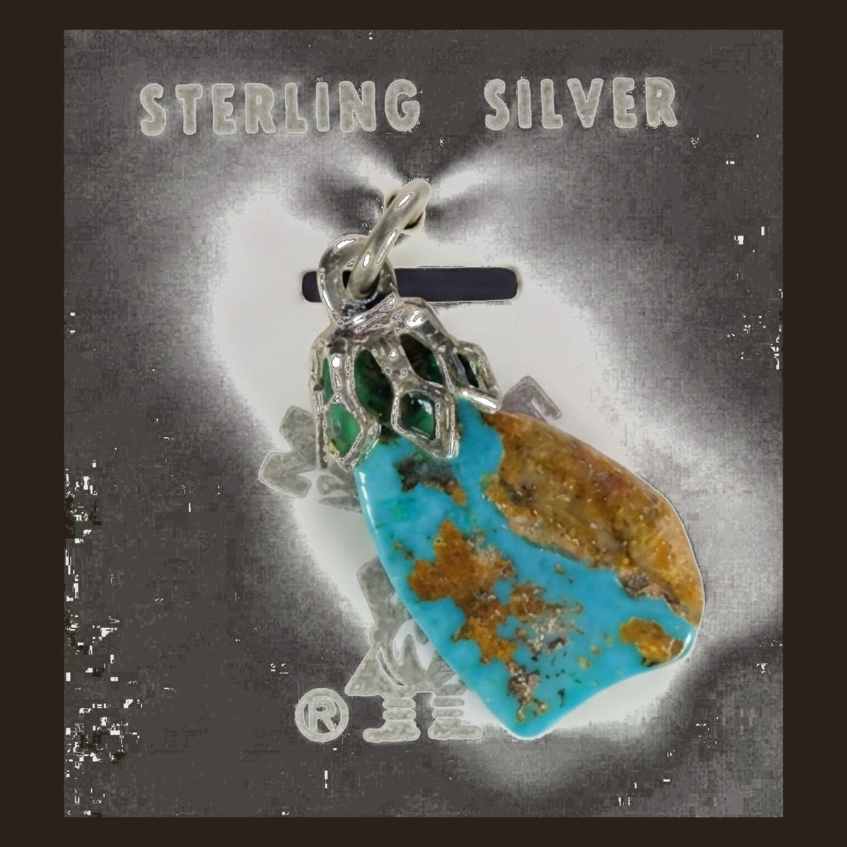 Vintage Maisel's Spiderweb Turquoise Nugget Pendant in Sterling Silver, New Old Stock, shown on an espresso background