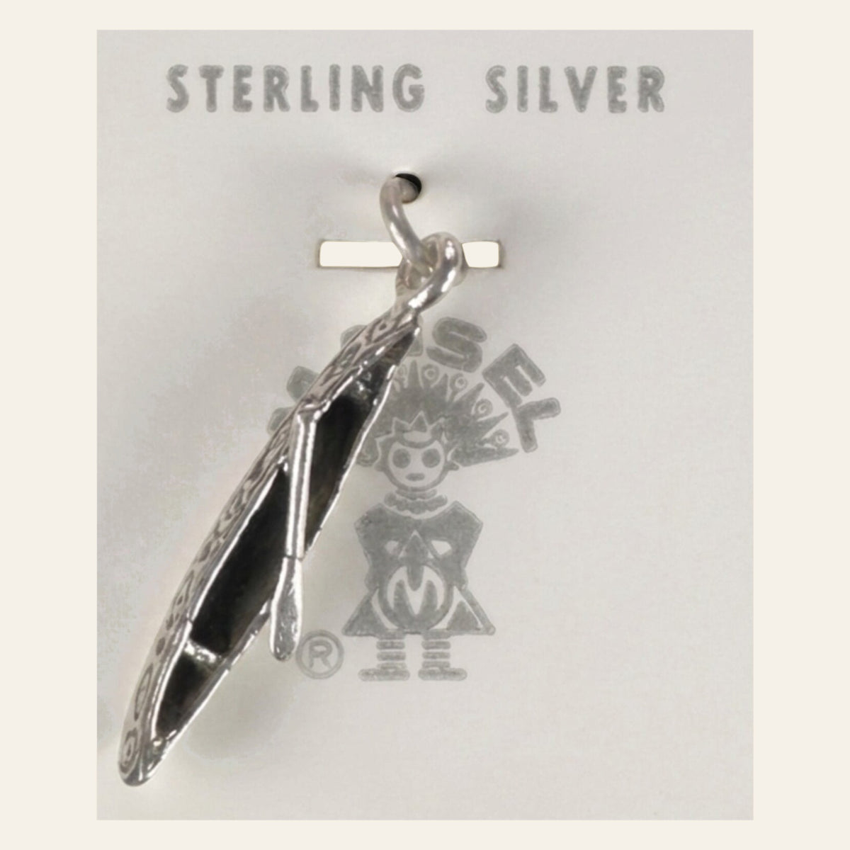 Vintage Maisel's Sterling Silver Canoe Charm, New Old Stock, shown on a cream background
