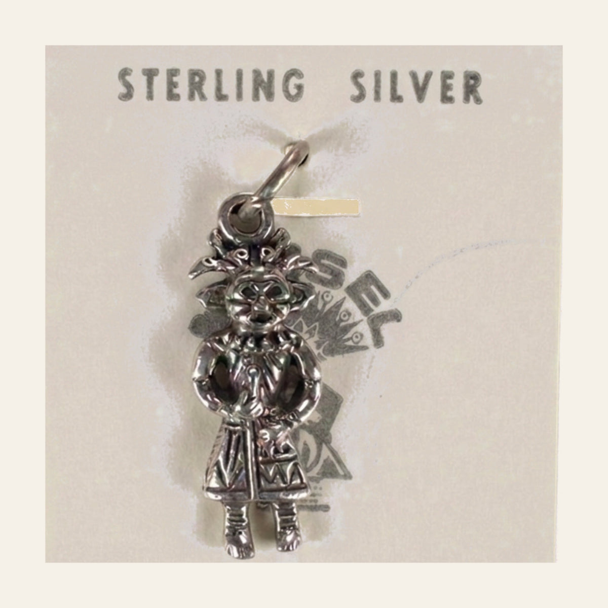 Vintage Maisel's Sterling Silver Standing Figure Charm, New Old Stock, shown on a cream background