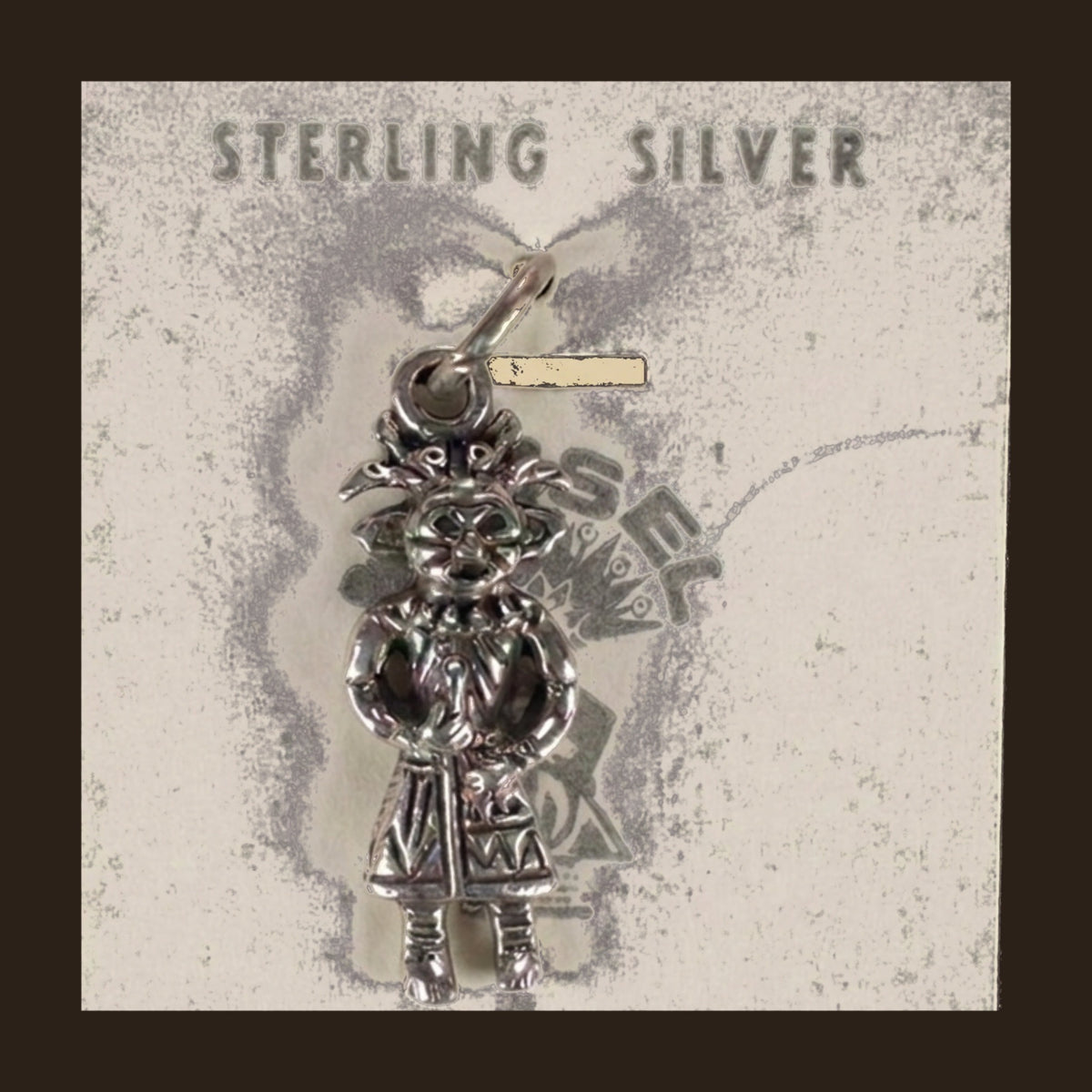 Vintage Maisel's Sterling Silver Standing Figure Charm, New Old Stock, shown on an espresso background