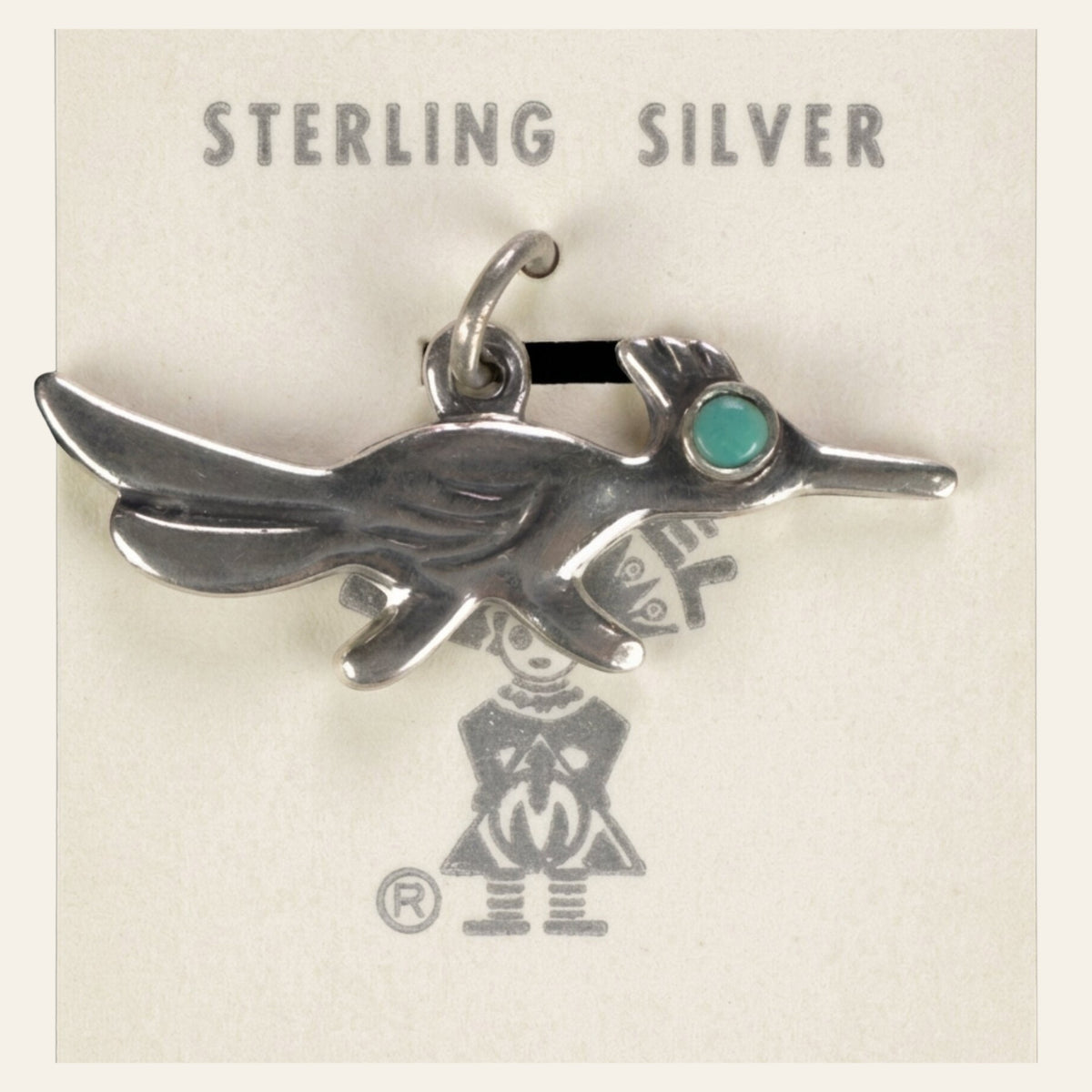 Vintage Maisel's Sterling Silver Turquoise Eye Roadrunner Charm, New Old Stock, shown on a cream background