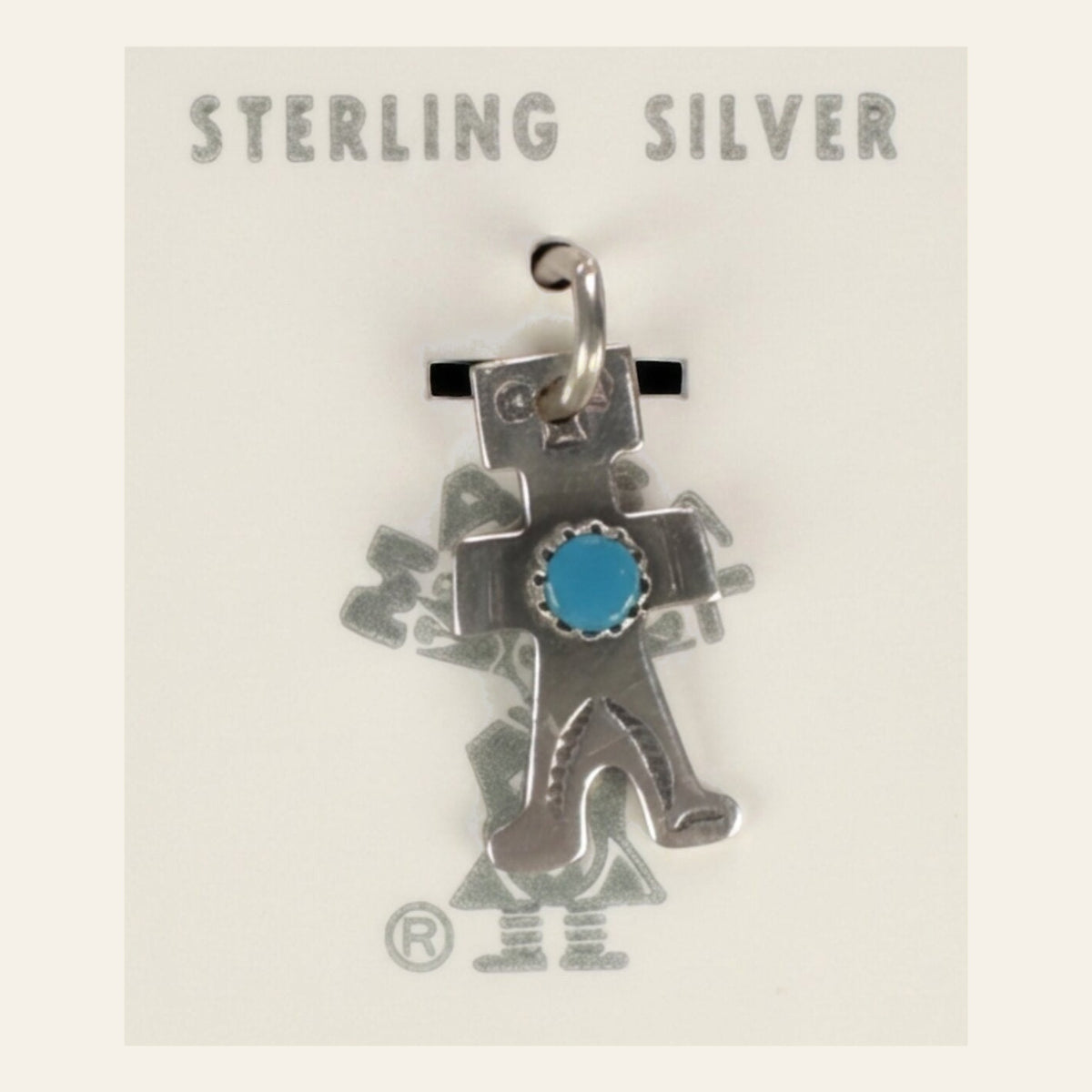 Vintage Maisel's Sterling Silver Turquoise Figure Charm, New Old Stock, shown on a cream background