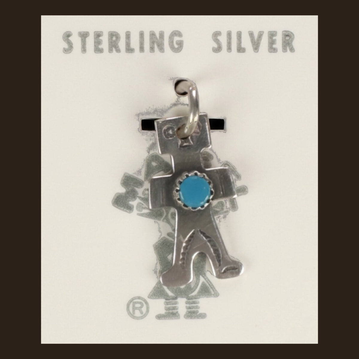 Vintage Maisel's Sterling Silver Turquoise Figure Charm, New Old Stock, shown on an espresso background