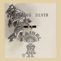 Vintage Maisel's Sterling Silver Buffalo Charm, New Old Stock, shown on a desert plaster background