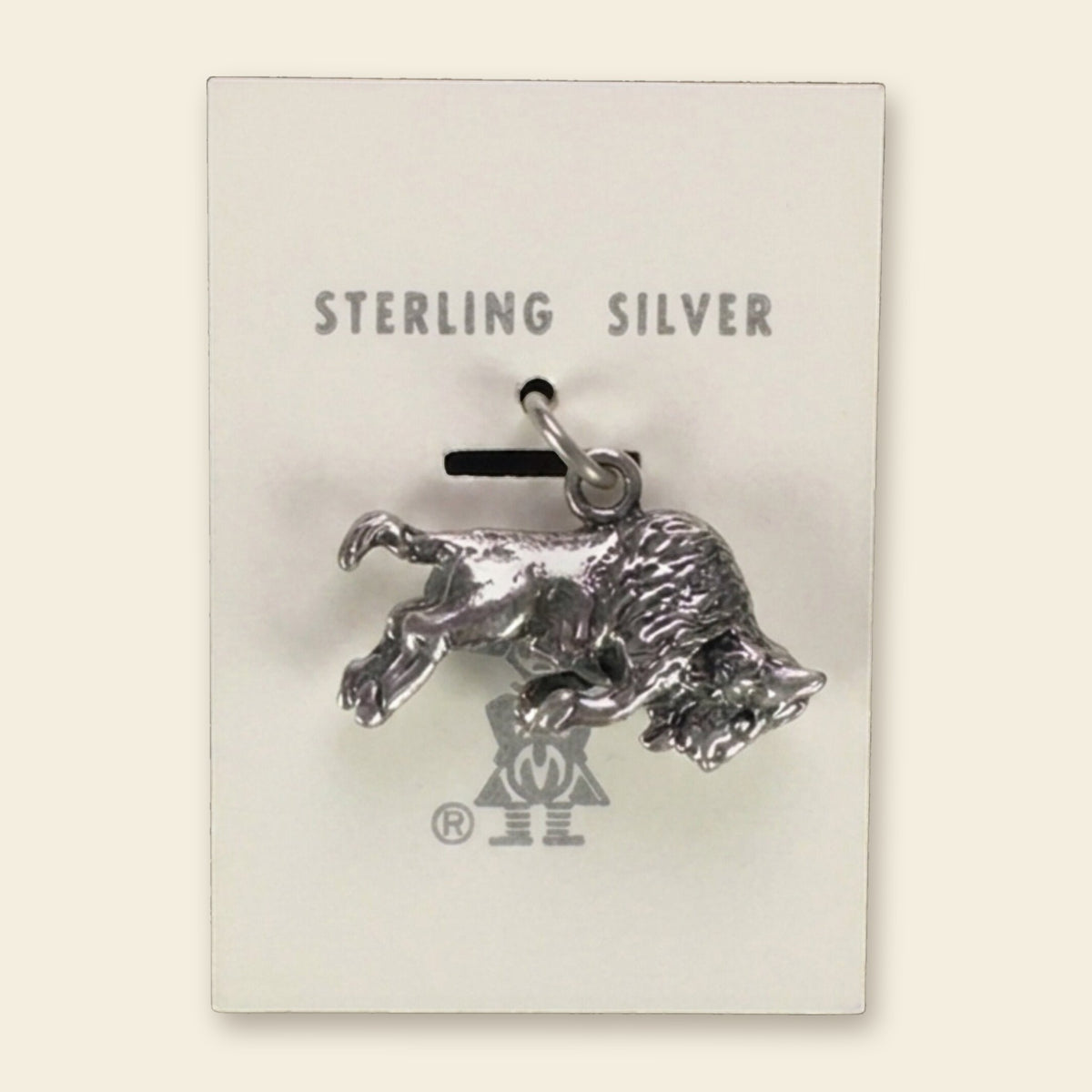 Vintage Maisel's Sterling Silver Buffalo Charm, New Old Stock, shown on an ivory background