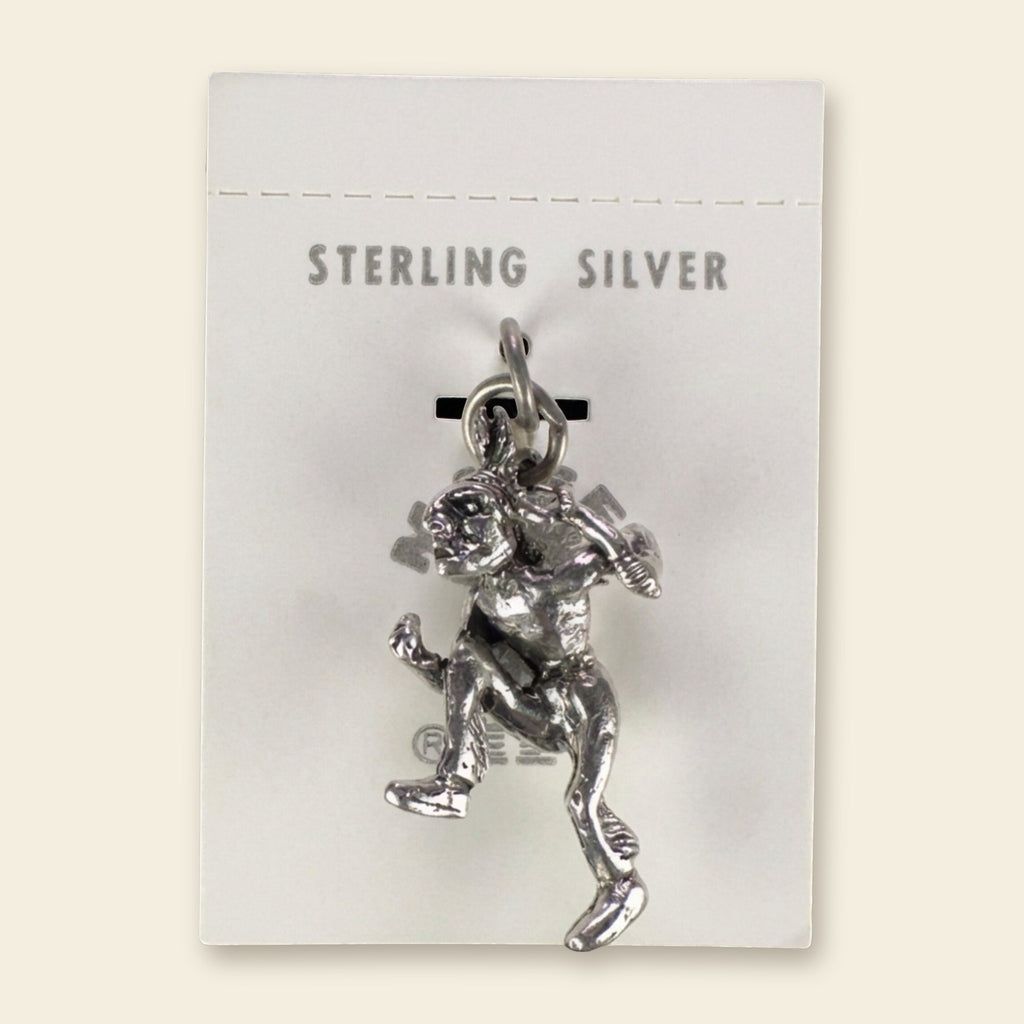 Vintage Maisel's Sterling Silver Dancer Charm, New Old Stock, shown on an ivory background