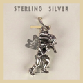 Vintage Maisel's Sterling Silver Dancer in Headdress Charm, New Old Stock, shown on a desert plaster background