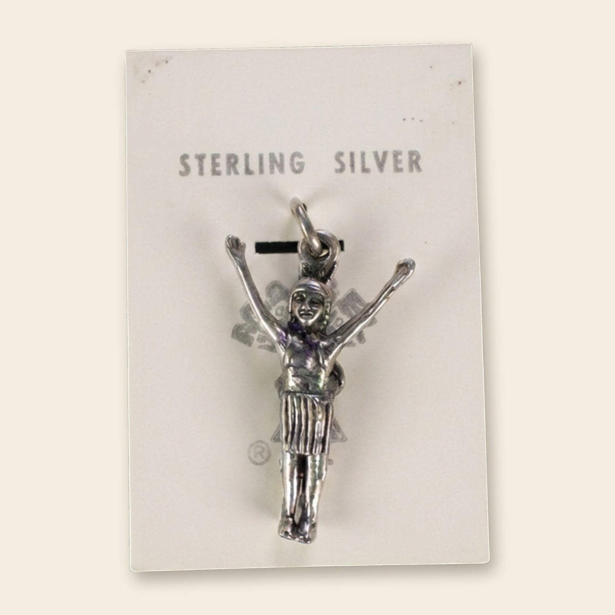 Vintage Maisel's Sterling Silver Figure with Arms Raised Charm, New Old Stock, shown on an ivory background
