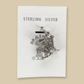 Vintage Maisel's Sterling Silver Jackrabbit Charm, New Old Stock, shown on a sand background