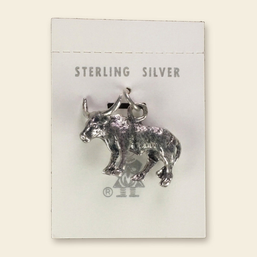 Vintage Maisel's Sterling Silver Longhorn Charm, New Old Stock, shown on an ivory background