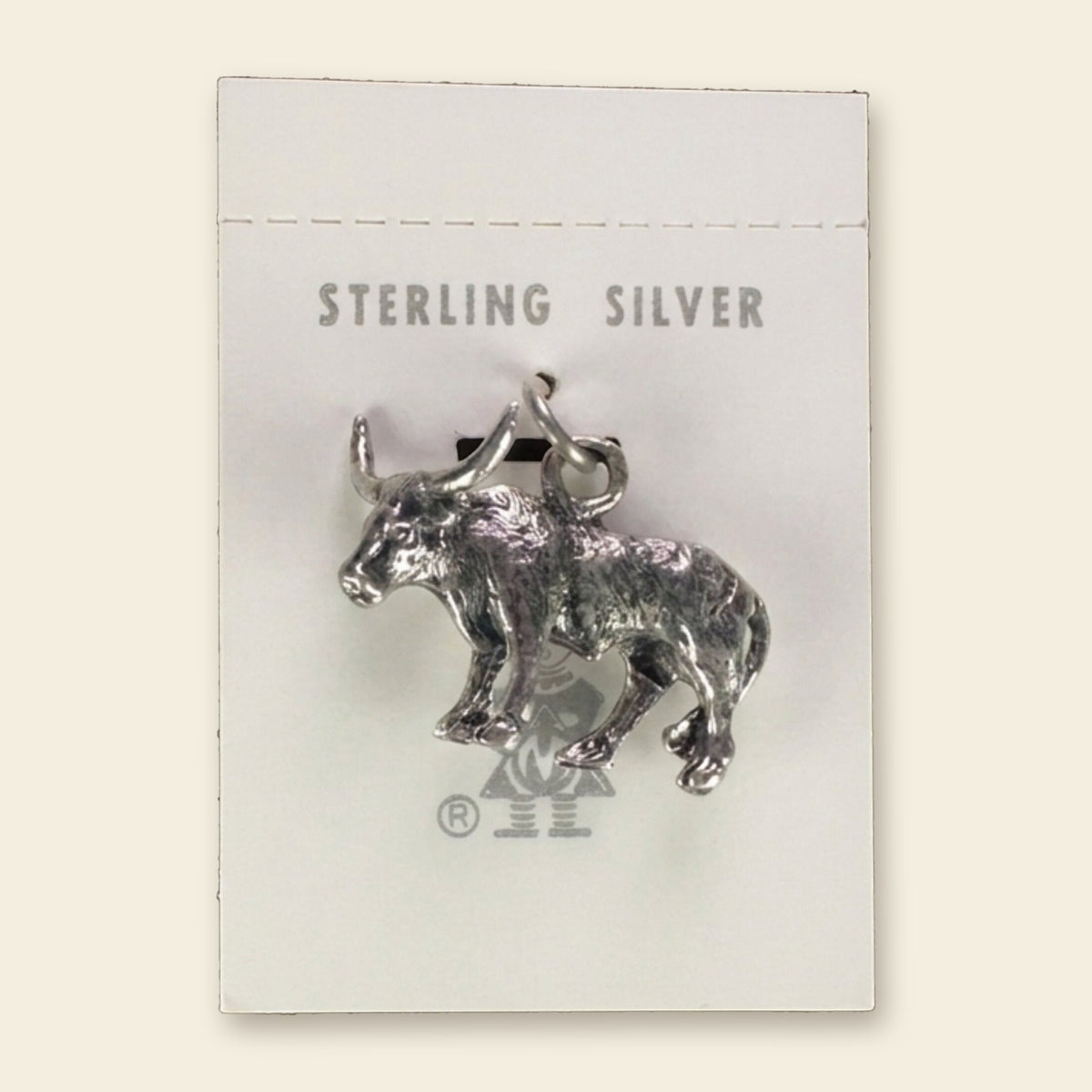 Vintage Maisel's Sterling Silver Longhorn Charm, New Old Stock, shown on an ivory background
