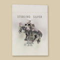 Vintage Maisel's Sterling Silver Longhorn Charm, New Old Stock, shown on a sand background