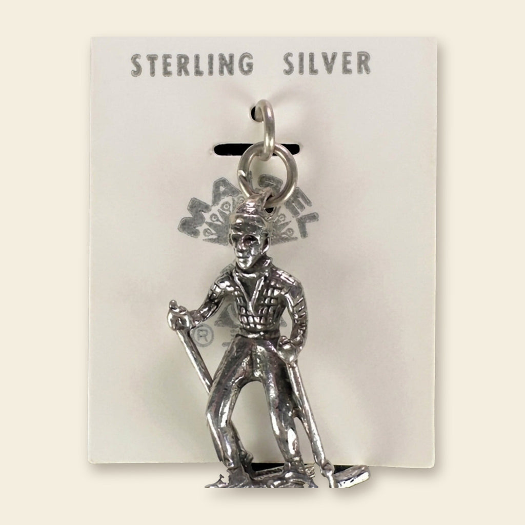 Vintage Maisel's Sterling Silver Skier Charm, New Old Stock, shown on an ivory background