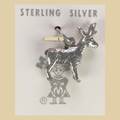 Vintage Maisel's Sterling Silver Standing Elk Charm, New Old Stock, shown on a desert plaster background
