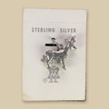 Vintage Maisel's Sterling Silver Standing Elk Charm, New Old Stock, shown on a sand background