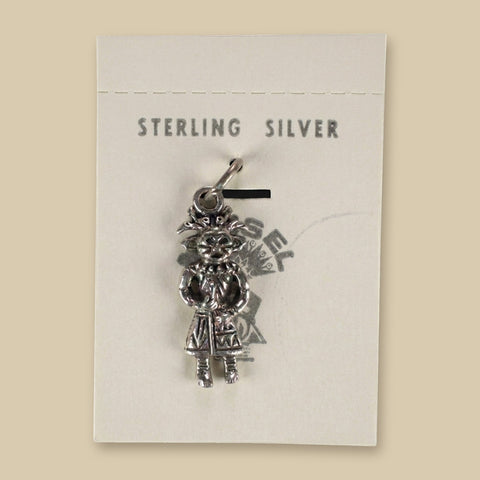 Vintage Maisel's Sterling Silver Standing Figure Charm, New Old Stock, shown on a sand background