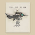 Vintage Maisel's Sterling Silver Turquoise Eye Roadrunner Charm, New Old Stock, shown on a sand background