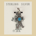 Vintage Maisel's Sterling Silver Turquoise Figure Charm, New Old Stock, shown on a desert plaster background