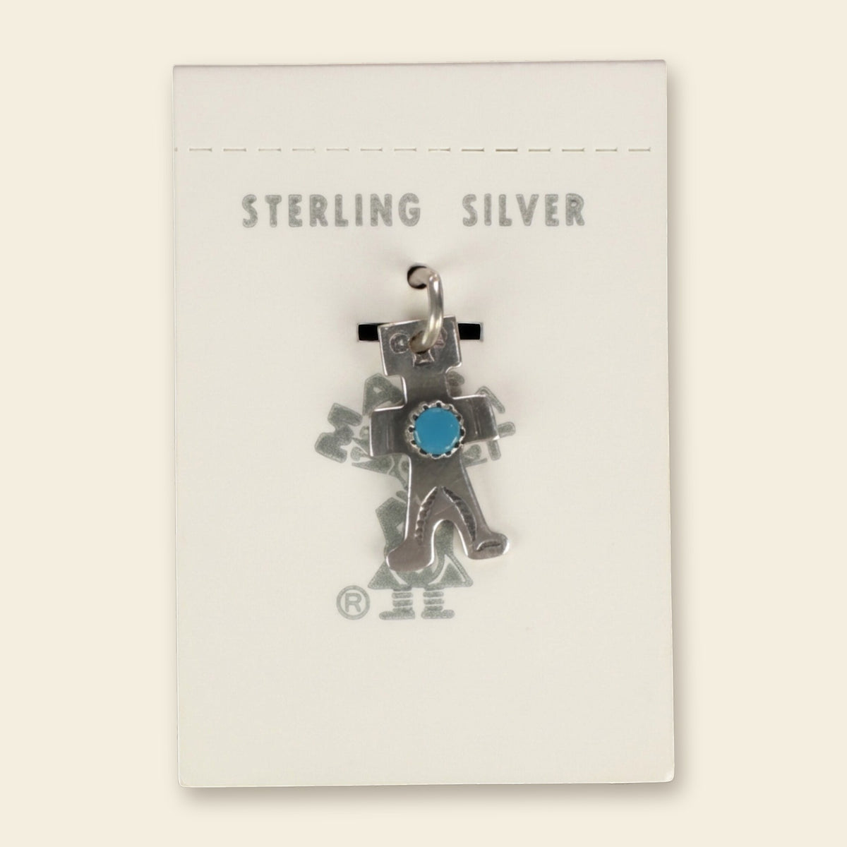 Vintage Maisel's Sterling Silver Turquoise Figure Charm, New Old Stock, shown on an ivory background