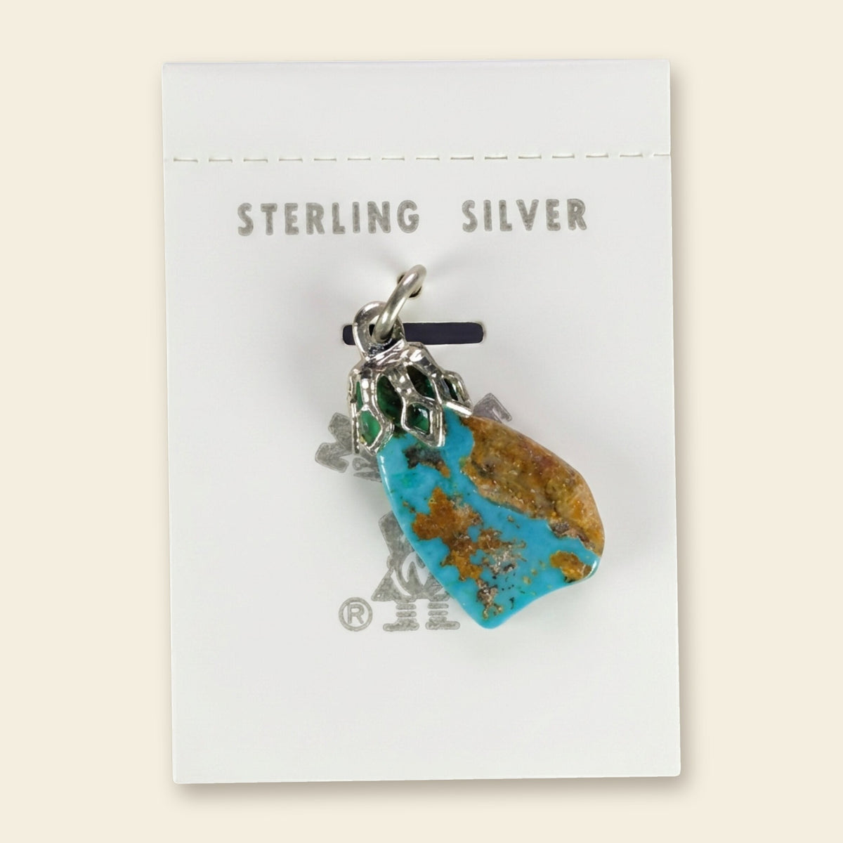 Vintage Maisel's Turquoise Nugget Sterling Silver Pendant, New Old Stock, shown on an ivory background