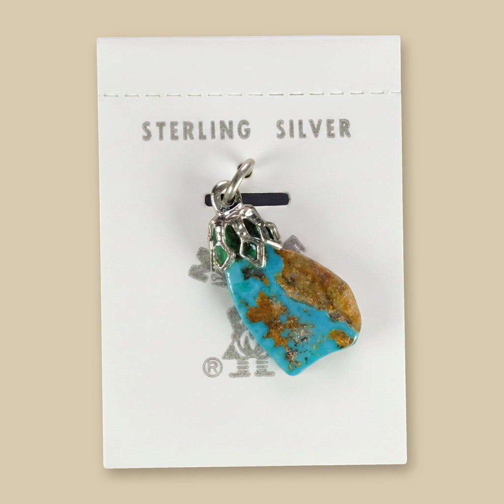 Vintage Maisel's Turquoise Nugget Sterling Silver Pendant, New Old Stock, shown on a sand background