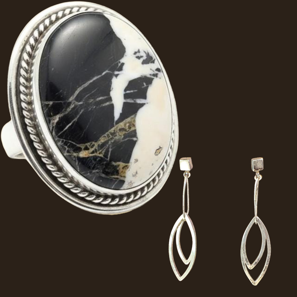 White Buffalo Ring and Leaf Earrings Set in Sterling Silver, Size 8, shown on an espresso background