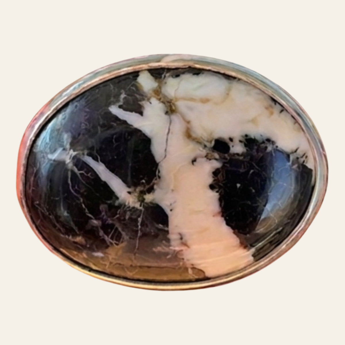White Buffalo Stone Ring in Sterling Silver, Size 6.5, shown on a cream background