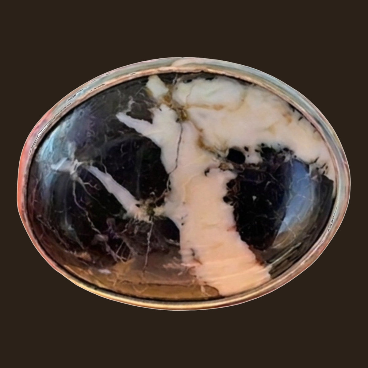 White Buffalo Stone Ring in Sterling Silver, Size 6.5, shown on an espresso background